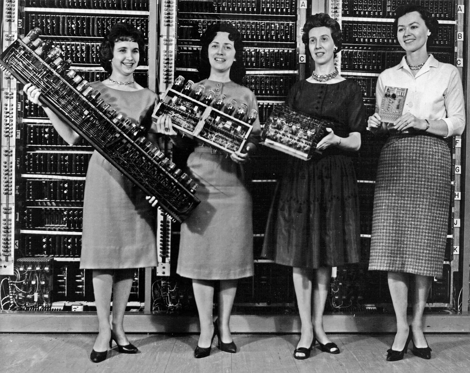 Four women holding circuit boards from the first four Army computers