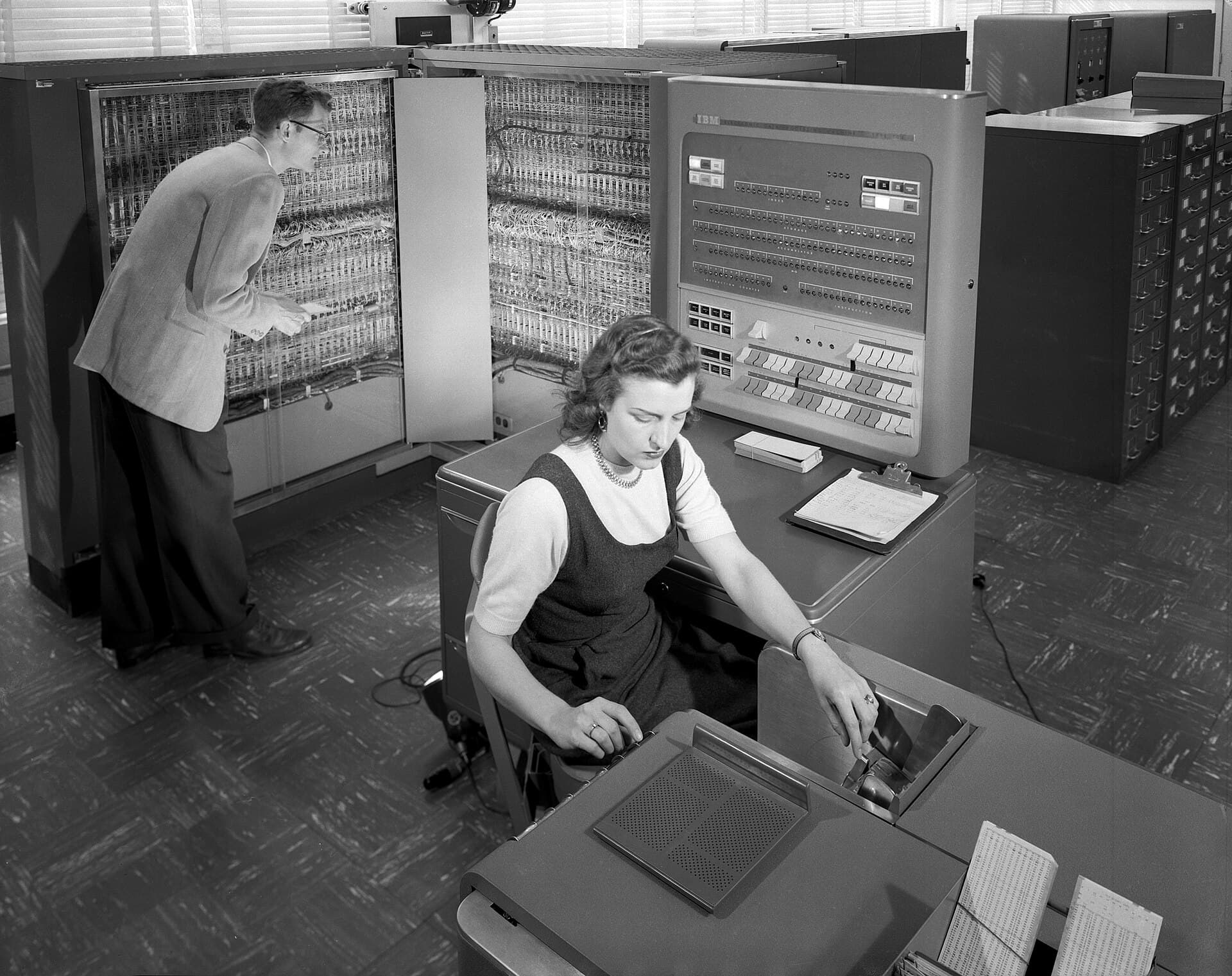 Engineers and an operator at an IBM electronic data processing machine