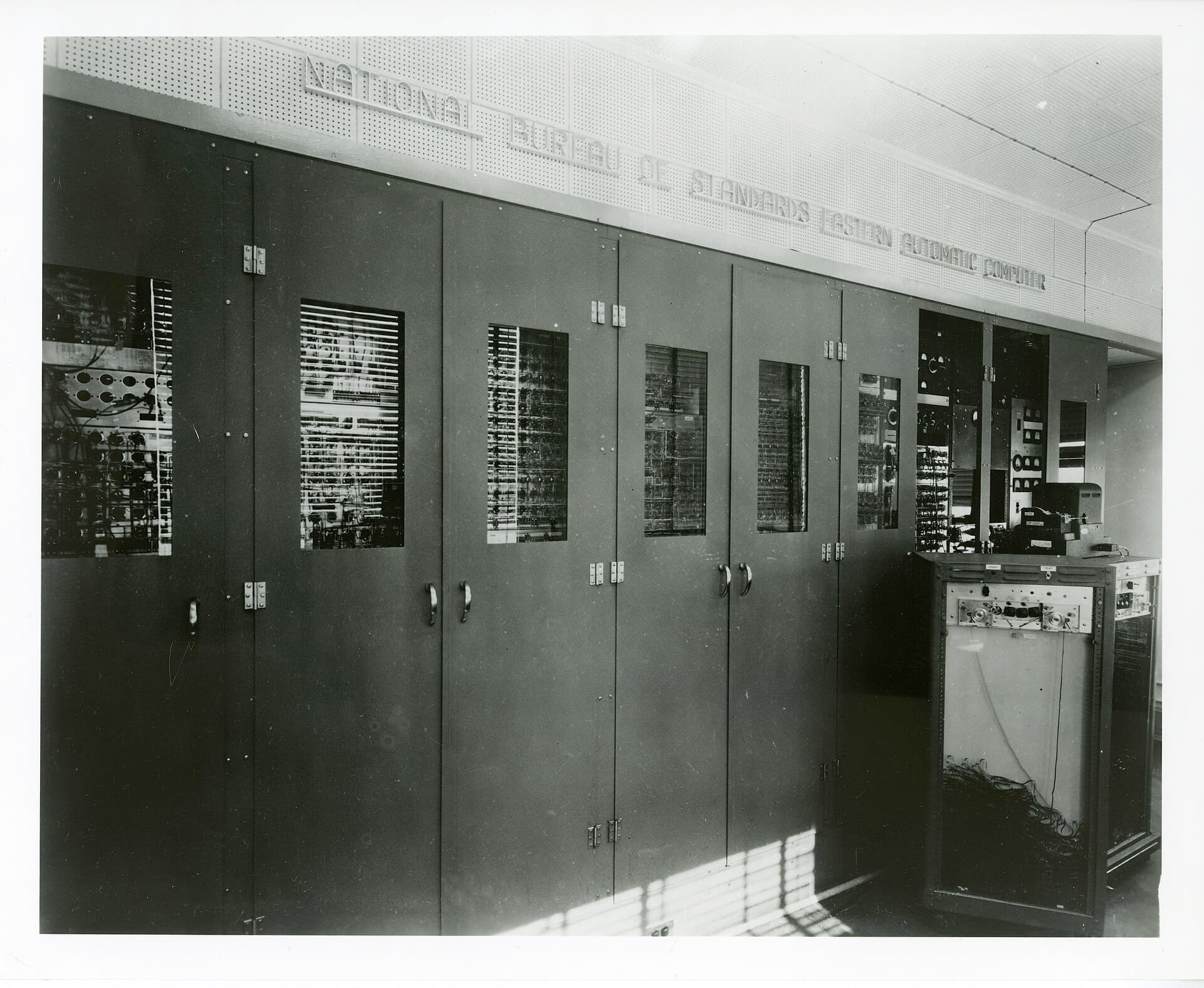 A row of tall SEAC equipment cabinets