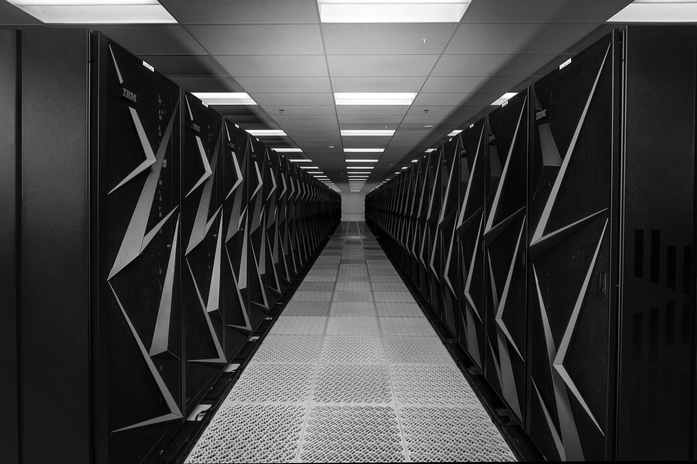 Rows of supercomputer cabinets in a data center